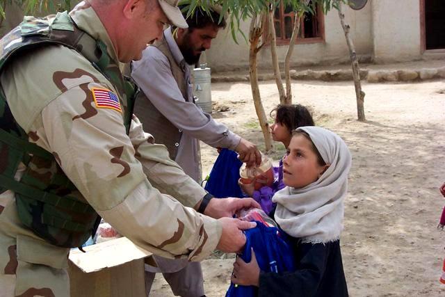 Civil affairs soldiers distribute BluePacks to school children in Jalalabad. (Photo courtesy of Civil Military Operations Center, Jalalabad)