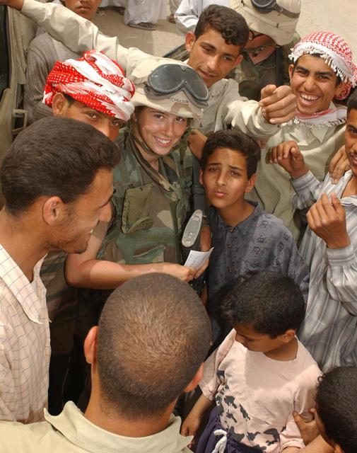 Spc. Shannon L. Nicholson, 3/12, psychological operations based out of Fort Bragg went to the town of Al Shomali to talk to local residents regarding what is needed to be done to get the local schools and electricity up and running again. (USMC Photo by Cpl. Matthew 'Aussie' Orr)