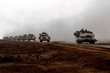 IRAQ (March 28, 2003) - Armored vehicles from TF 3-69 roll north toward Al Samawa, Iraq March 22. U.S. Army photo by Sgt. Craig Zentkovich