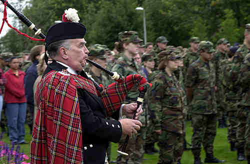 Norman Taflinger, 3rd Air Force, Royal Air Force Mildenhall, plays 'Amazing Grace' on his bagpipes after observing a three minute silence held at RAF Lakenheath in honor of those that lost their lives during the terrorist attack in New York and Washington D.C. The silence was observed all over the United Kingdom in which daily lives stopped to pay respect to those fallen in the recent tragedy. (United States Air Force photo by Staff Sergeant William Greer)